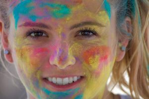 NOMINATED A beautiful woman with colors on her face from a Holi color festival