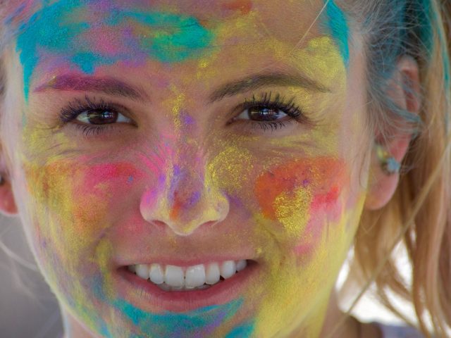 NOMINATED A beautiful woman with colors on her face from a Holi color festival